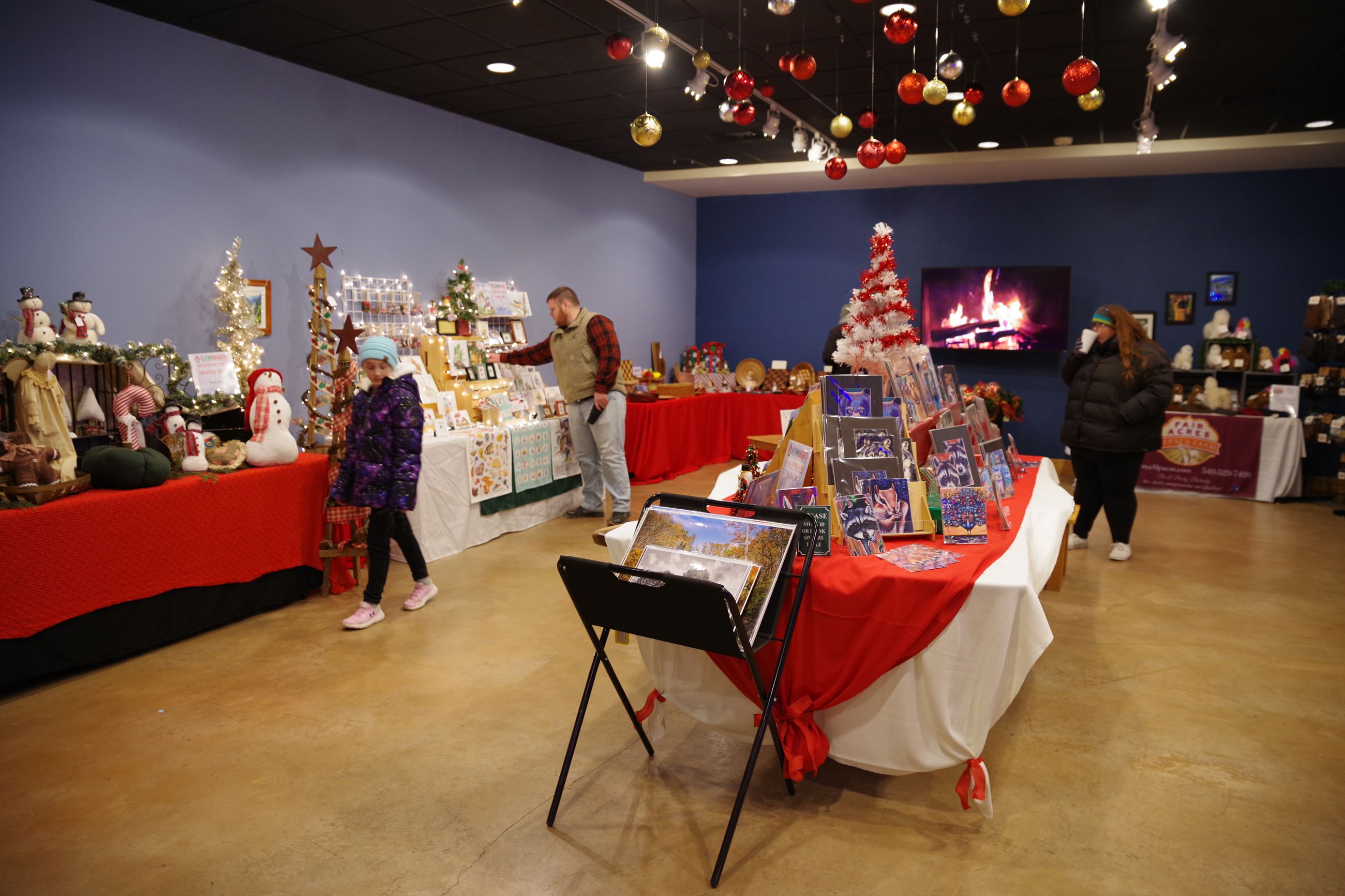 Visitors browse at the Explore Park Artisan Market